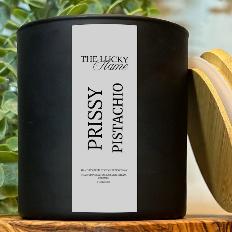 Prissy Pistachio Candle by The Lucky Flame, featuring notes of almond slices, toasted pistachio, wildflower honey, cinnamon, vanilla bean, and golden caramel.