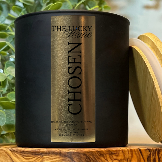 9 oz Chosen Candle made with coconut soy wax, featuring bright notes of orange, sea salt, and amber. Part of The Lucky Flame’s Extra Lucky Collection supporting Down syndrome awareness.