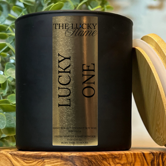 9 oz Lucky One Candle from the Extra Lucky Down Syndrome Collection. Features soft notes of apricot and baby powder in a clean-burning coconut soy blend.