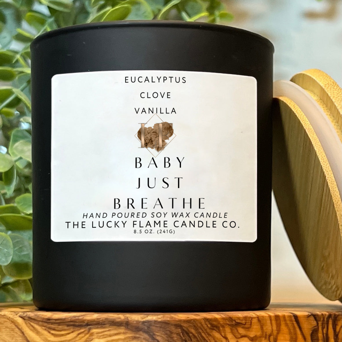 An exquisite Baby Just Breathe candle, elegantly infused with the soothing notes of fresh eucalyptus, warm clove, and rich vanilla. An emblem of sustainable luxury, this eco-conscious creation emanates tranquility and refinement.